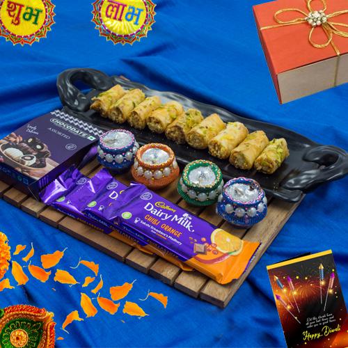 Finest Selection of Roll Baklava n Cadbury Chocolates with Wax Diya