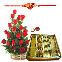 Classic Arrangement of Roses in a Basket and Assorted Sweets Gift Pack with Free Rakhi Roli Tika and Chawal for Rakhi Celebration