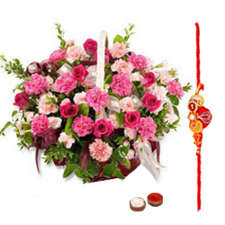 Pretty Gift Arrangement of Roses and Seasonal Flowers in a Basket with free Rakhi, Roli Tika and Chawal for Special Rakhi Festival<br>