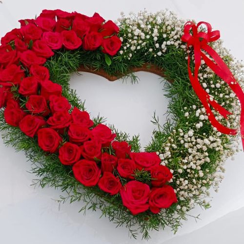Designer Heart Shaped Arrangement of Red Rose with white Baby Breath fillers