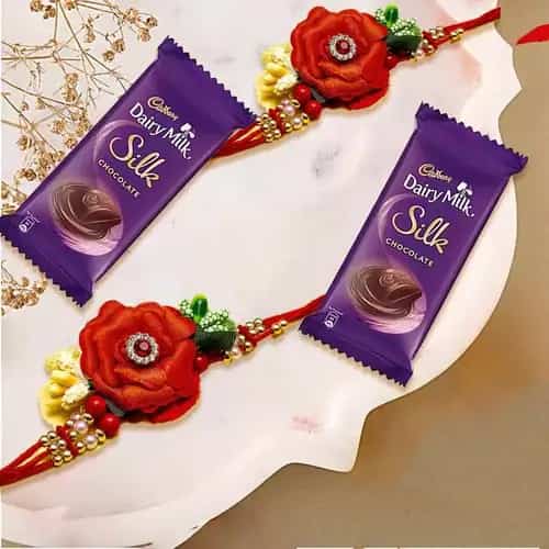 Beautiful Twin Flower Rakhi Set with Cadbury Dairy Milk Silk Chocolate Bar